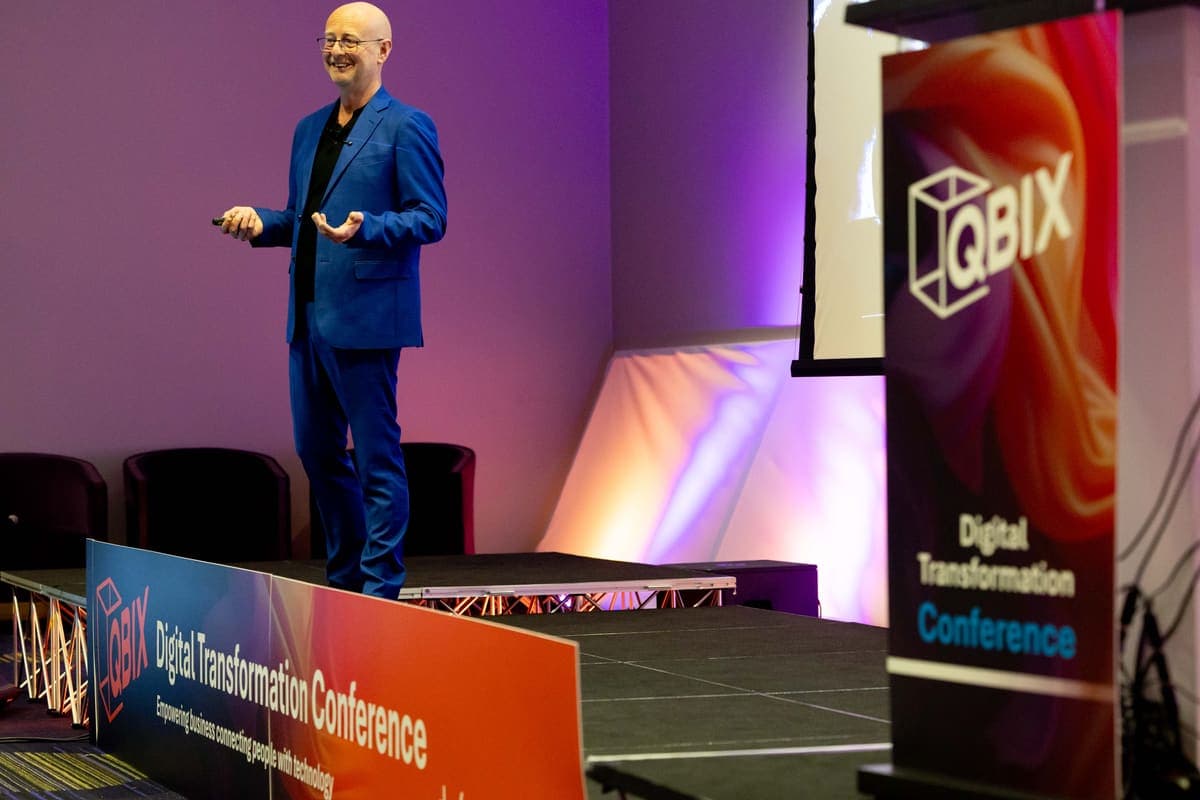 Andy Jarvis presenting with both arms raised