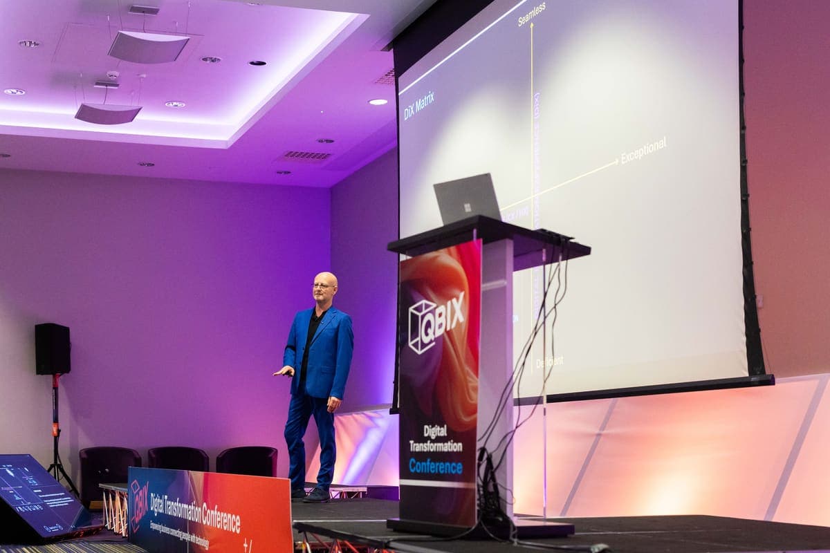 Wide shot of Andy Jarvis on stage with the audience